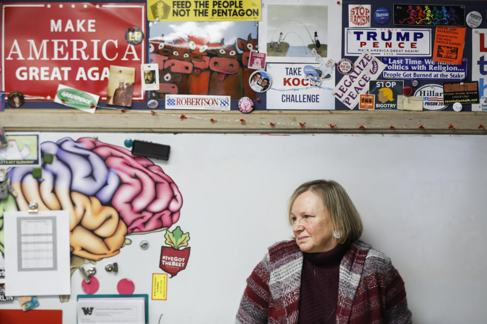 In this Thursday, Jan. 24, 2019, photo social studies teacher Judi Galasso co-leads the introductory class of their American Thought and Political Radicalism course at Thomas Worthington High School, in Worthington, Ohio. (AP Photo/John Minchillo)