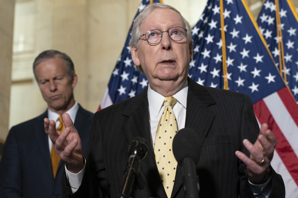 Senate Minority Leader Mitch McConnell of Ky., right, speaks to the media next to Sen. John Thune, R-S.D., Tuesday, May 18, 2021, after a meeting with Senate Republicans on Capitol Hill in Washington. (AP Photo/Jacquelyn Martin)