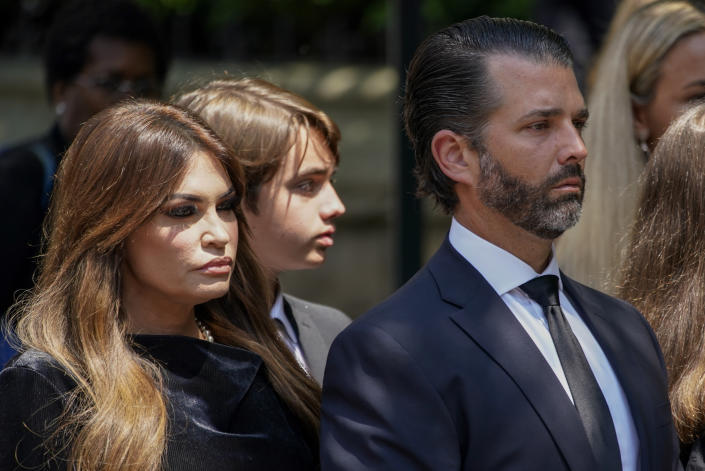 Donald Trump Jr., right, arrives with Kimberly Guilfoyle, for the funeral of Ivana Trump, Wednesday, July 20, 2022, in New York. Ivana Trump, an icon of 1980s style, wealth and excess and a businesswoman who helped her husband build an empire that launched him to the presidency, is set to be celebrated at a funeral Mass at St. Vincent Ferrer Roman Catholic Church following her death last week. (AP Photo/Julia Nikhinson)