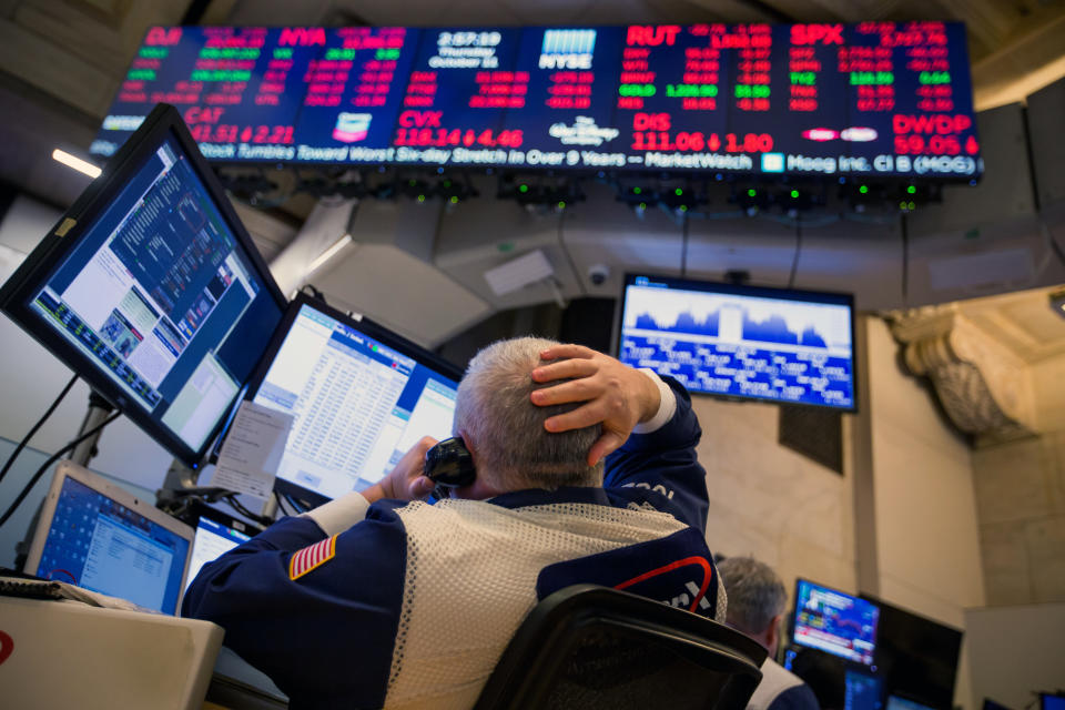 A trader works on the floor of the New York Stock Exchange (NYSE) in New York, U.S., on Thursday, Oct. 11, 2018. U.S. stocks fell for a sixth day, extending the longest losing streak of Donald Trump’s presidency, as energy shares plunged and a rally in tech failed to lift the broader market. Photographer: Michael Nagle/Bloomberg via Getty Images