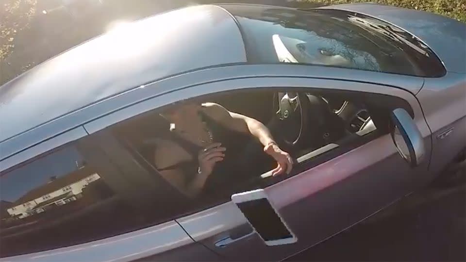 Things took a turn for the worse, when the now enraged motorcyclist took the iPhone off the roof of the car and dropped it on the pavement. Source: YouTube