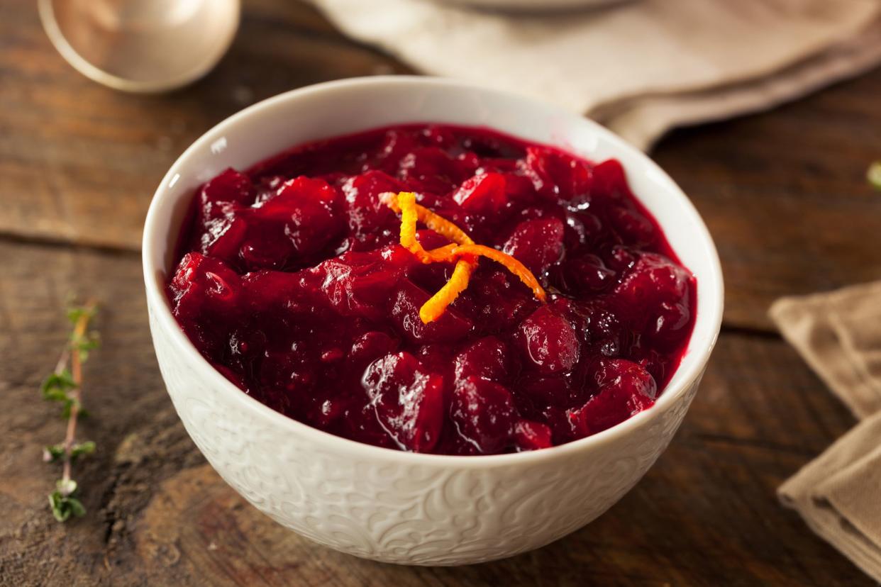 cranberry sauce with orange garnish in bowl