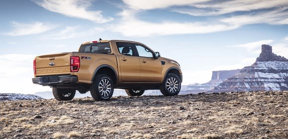 The 2019 Ford Ranger pickup viewed from a rear three-quarter angle, on a desert landscape.