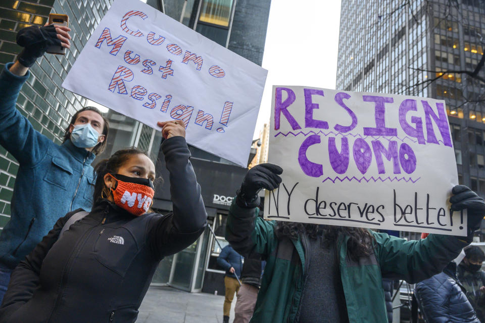 People rally for New York Gov. Andrew Cuomo's resignation in front of his Manhattan office in New York, Tuesday, March 2, 2021. Cuomo is facing calls for resignations from some members of his own party as most leading Democrats signal they want to await the results of the attorney general’s investigation into claims the governor sexually harassed aides. (AP Photo/Brittainy Newman)