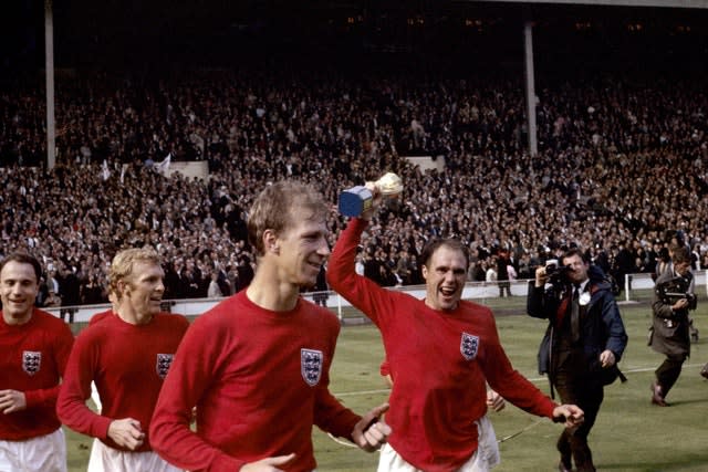 England’s George Cohen, Bobby Moore, Jack Charlton and Ray Wilson, with trophy, celebrate after winning the World Cup in 1966