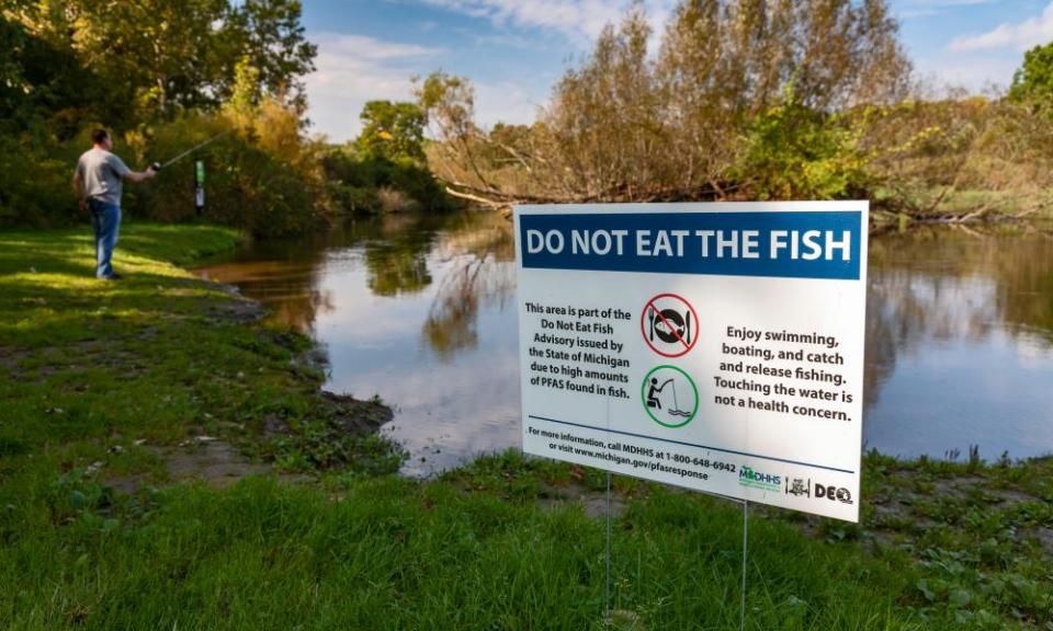 A sign warns anglers not to eat fish from the Huron River because of high levels of PFAS contamination.