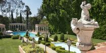 <p>The stunning gardens were designed by Paul Thiene, and include layered waterfalls to the pool.</p>