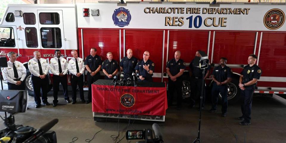 Charlotte Station 10 Capt. Jeff Bright, center, speaks during a press conference detailing the five-alarm fire in SouthPark on May 18.