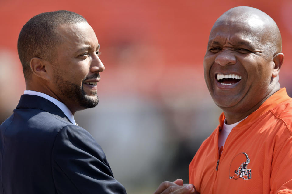 Browns GM Sashi Brown (left) was fired Thursday and the team's owner said Hue Jackson would remain head coach in the 2018 season. (AP) 