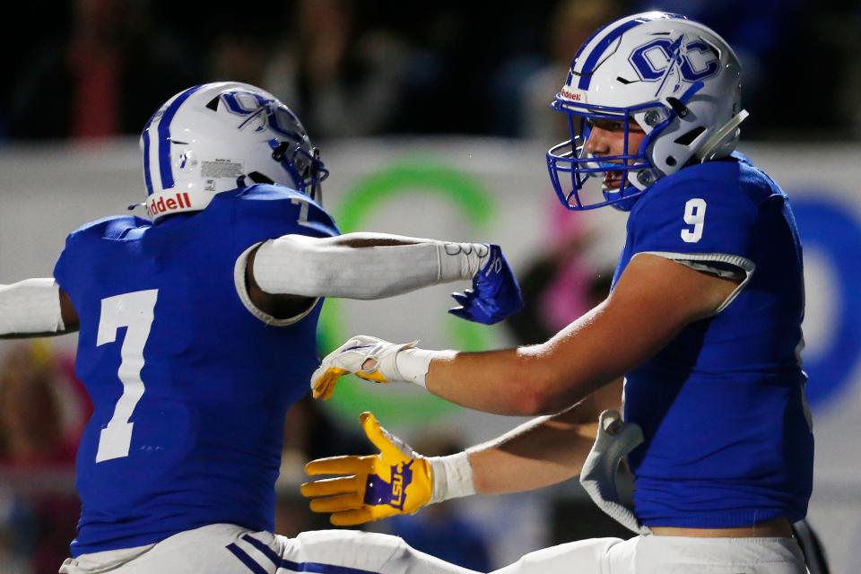 Oconee County’s Jake Johnson (9) celebrates with CJ Jones after scoring a touchdown against Monroe Area on Oct. 22.<br>News Joshua L Jones