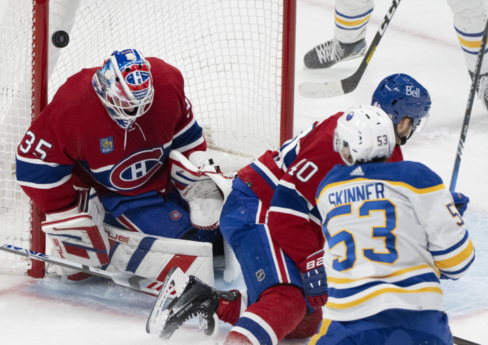 Buffalo Sabres' Jeff Skinner (53) scores on Montreal Canadiens goaltender Sam Montembeault (35) as Canadiens' Joel Armia (40) defends during the second period of an NHL hockey game Wednesday, Feb. 21, 2024, in Montreal. (Christinne Muschi/The Canadian Press via AP)