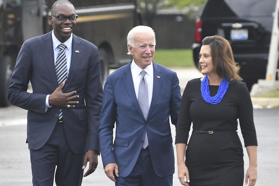 FILE - In this Sept. 12, 2018 file photo, from left, gubernatorial running mate Garland Gilchrist, former Vice President Joe Biden and Michigan Democratic gubernatorial candidate Gretchen Whitmer arrive at Leo's Coney Island in Southfield, Mich. On Friday, April 24, 2020, The Associated Press reported on photos circulating online incorrectly asserting Biden and Whitmer violated social distancing rules on April 9, 2020. The September 2018 photos were made when Biden was campaigning in Michigan for Whitmer. (Daniel Mears/The Detroit News via AP)\