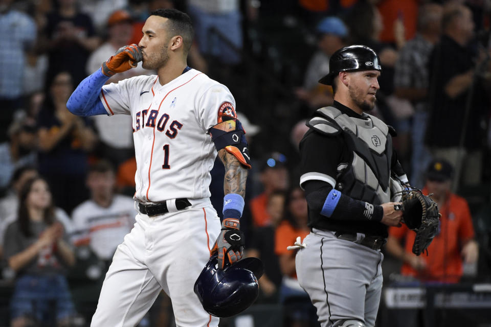 Houston Astros' Carlos Correa (1) celebrates his solo home run during the fourth inning of a baseball game against the Chicago White Sox, Sunday, June 20, 2021, in Houston. (AP Photo/Eric Christian Smith)