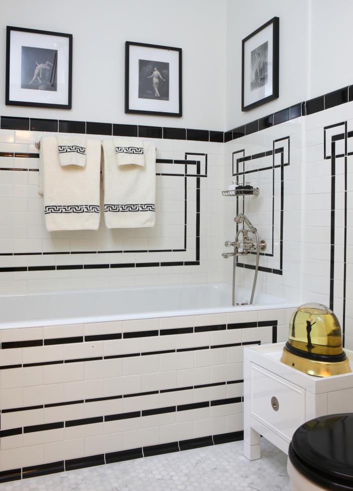 The bathroom in a Jessica Lagrange Interiors project. The streamlined, geometric tile accents add an undeniable Deco touch without going overboard.