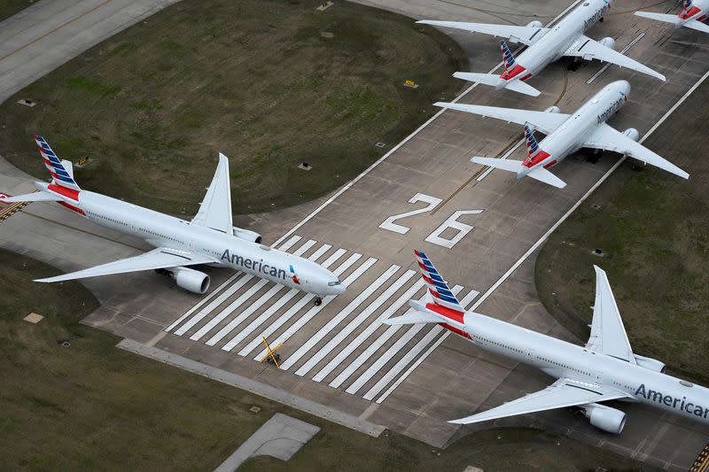 FILE PHOTO: American Airlines passenger planes crowd a runway in Tulsa