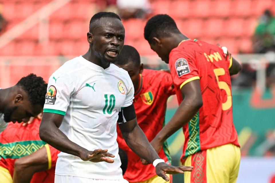 Sadio Mane urges his Senegal teammates on against Guinea in Cameroon (AFP)