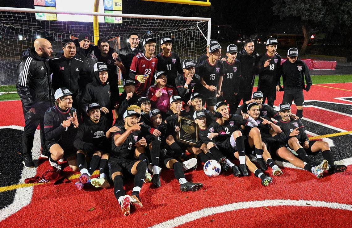 McLane high boys soccer players celebrate their Central Section Division III boys soccer championship win over Chavez at McLane Stadium on Friday, Feb. 24, 2023.
