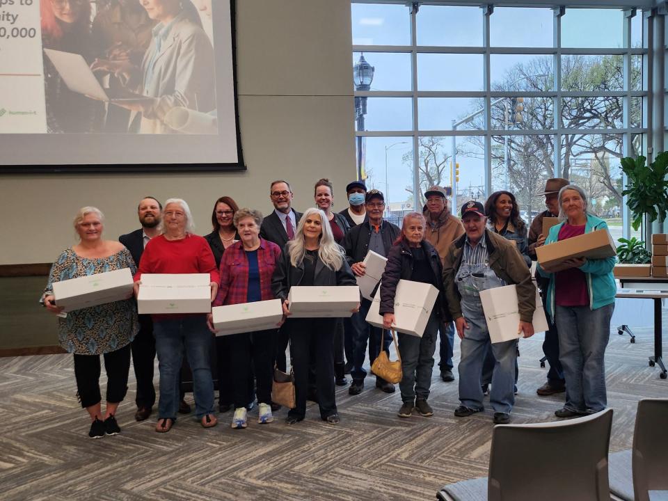 AT&T, in collaboration with the Amarillo Area Foundation, presents area senior citizens with 75 refurbished laptops in an effort to bridge the digital divide.