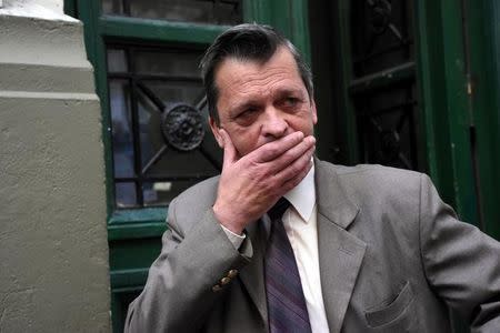 Professor Ricardo Berlot, who was a teacher of the five Argentine citizens of Rosario who were killed in the truck attack in New York on October 31, reacts as he talks to journalists outside the Instituto Politecnico, a technical high school in Rosario, Argentina November 1, 2017. REUTERS/Stringer