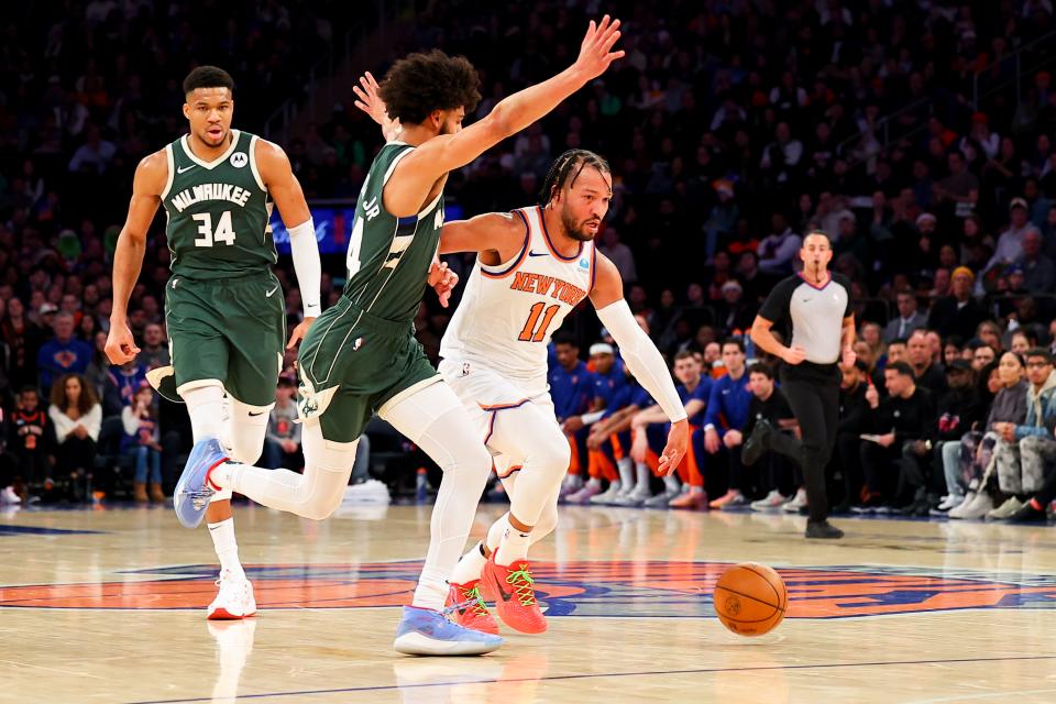 NEW YORK, NEW YORK - DECEMBER 25: Jalen Brunson #11 of the New York Knicks drives against Andre Jackson Jr. #44 of the Milwaukee Bucks during the first quarter of the game at Madison Square Garden on December 25, 2023 in New York City.  NOTE TO USER: User expressly acknowledges and agrees that, by downloading and or using this photograph, User is consenting to the terms and conditions of the Getty Images License Agreement. (Photo by Rich Graessle/Getty Images)