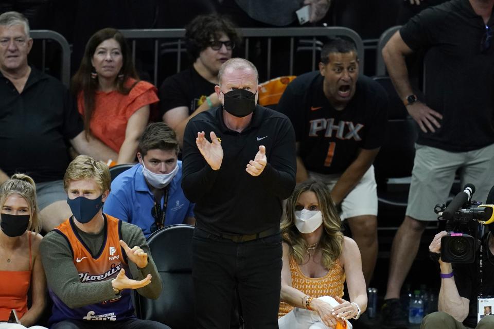 FILE - Phoenix Suns owner Robert Sarver applauds his team during the second half of Game 1 of the NBA basketball Western Conference finals against the Los Angeles Clippers, Sunday, June 20, 2021, in Phoenix. The Suns defeated the Clippers 120-114. Robert Sarver says he has started the process of selling the Phoenix Suns and Phoenix Mercury, a move that comes only eight days after he was suspended by the NBA over workplace misconduct including racist speech and hostile behavior toward employees. Sarver made the announcement Wednesday, Sept. 21, 2022, saying selling “is the best course of action.” He has owned the teams since 2004.(AP Photo/Ross D. Franklin, File)