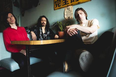 Virgil Howe (centre) has died unexpectedly aged 42