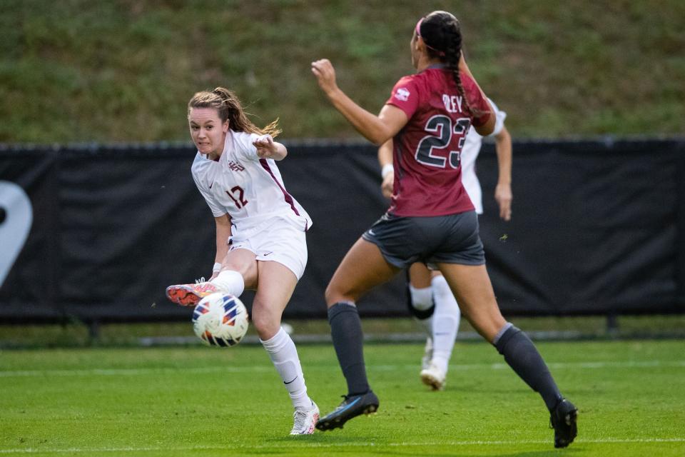 Florida State Seminole Heather Payne (12) passes to er teammate. The Florida State Seminoles defeated the Arkansas Razorbacks 1-0 in an Elite Eight matchup Saturday, Nov. 26, 2022.