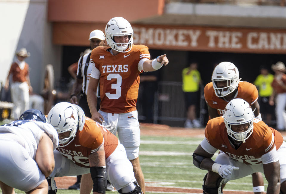 Texas quarterback Quinn Ewers signals his team during the first half of an NCAA football game against Rice, Saturday, Sept. 2, 2023, in Austin, Texas. (AP Photo/Michael Thomas)
