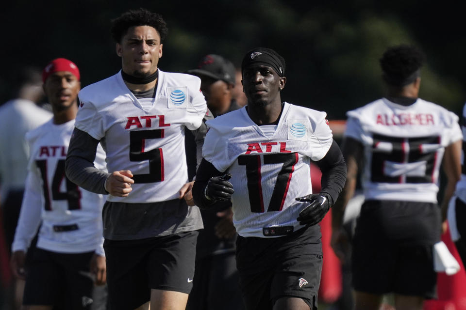 Atlanta Falcons wide receivers Olamide Zaccheaus (17) and Drake London (5) take part in drills at the NFL football team's practice facility on Thursday, July 28, 2022, in Flowery Branch, Ga. (AP Photo/Brynn Anderson)