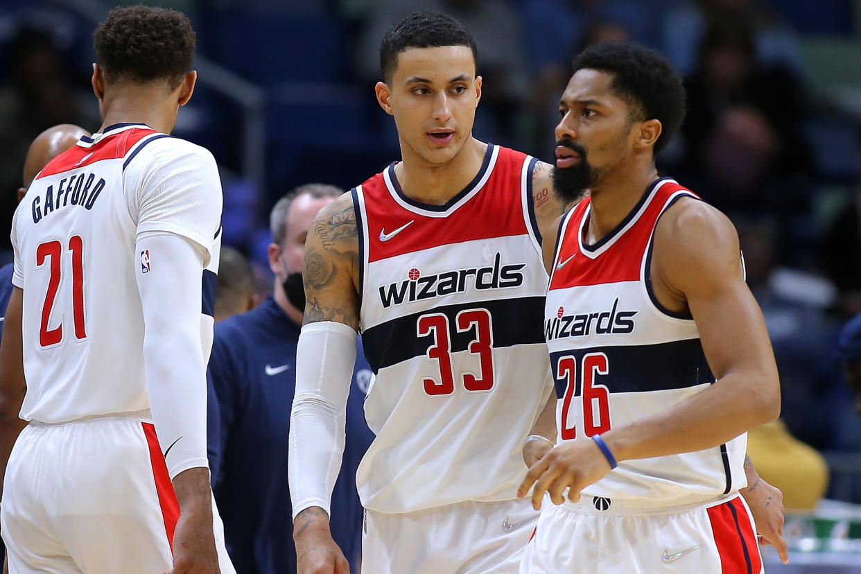 NEW ORLEANS, LOUISIANA - NOVEMBER 24: Kyle Kuzma #33 of the Washington Wizards talks to Spencer Dinwiddie #26 during the second half of a game against the New Orleans Pelicans at the Smoothie King Center on November 24, 2021 in New Orleans, Louisiana. NOTE TO USER: User expressly acknowledges and agrees that, by downloading and or using this Photograph, user is consenting to the terms and conditions of the Getty Images License Agreement. (Photo by Jonathan Bachman/Getty Images)