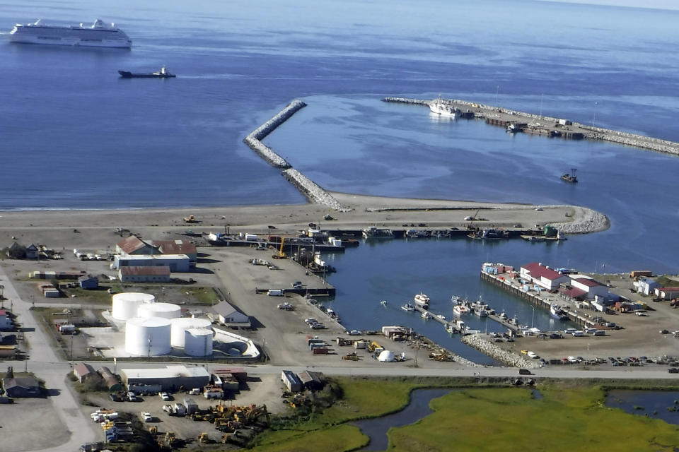 This Aug. 20, 2017, photo provided by the City of Nome is an aerial view of the Port of Nome, Alaska, with the luxury cruise ship Crystal Serenity anchored offshore because it was too big to dock at the port. Shipping lanes that were once clogged with ice for much of the year along Alaska's western and northern coasts have relented thanks to global warming, and the nation's first deep water Arctic port should be operational in Nome by the end of the decade. (Nome Port Director Joy Baker/City of Nome via AP)
