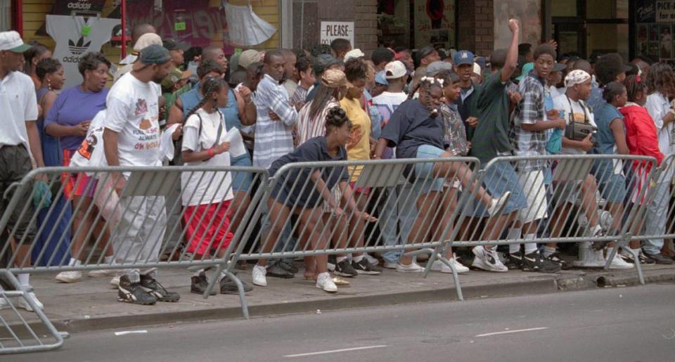 A crowd on Peachtree Street near Underground Atlanta on Saturday, April 22, 1995 pushes over a city barricade in open defiance of a group of nearby police officers. The gathering centered around the three day long Freaknik ’95 celebration. Freaknik was an annual gathering of students from traditionally Black colleges in Atlanta. (AP Photo/Andrew Innerarity) ANDREW INNERARITY/ASSOCIATED PRESS