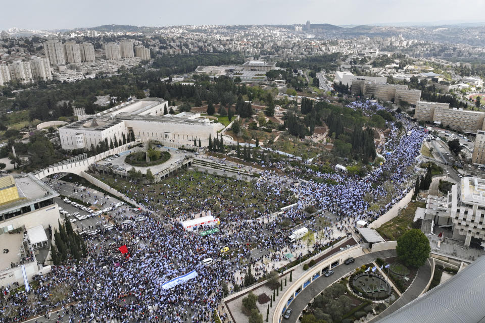 Tens of thousands Israelis protest against Prime Minister Benjamin Netanyahu's judicial overhaul plan outside the parliament in Jerusalem, Monday, March 27, 2023. (AP Photo)