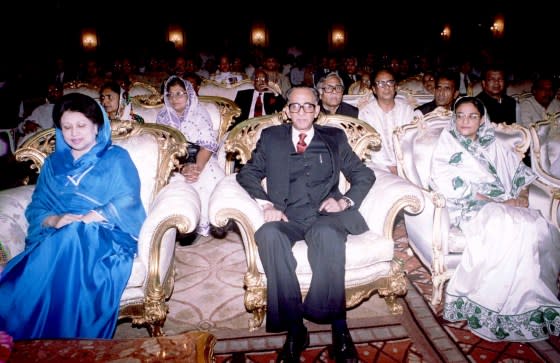 Former Chief Justice Habibur Rahman, center, is flanked by outgoing Prime Minister Khaleda Zia, left, and then-opposition leader Sheikh Hasina, right, at the swearing in for Rahman at the presidential palace on March 30. Rahman was appointed as chief of the interim administration to oversee general elections.<span class="copyright">Reuters</span>