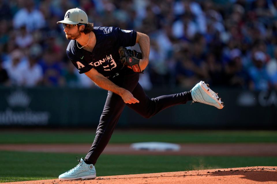 Jul 11, 2023; Seattle, Washington, USA; National League pitcher Zac Gallen of the Arizona Diamondbacks (23) throws a pitch against the American League during the first inning at T-Mobile Park. Mandatory Credit: Stephen Brashear-USA TODAY Sports