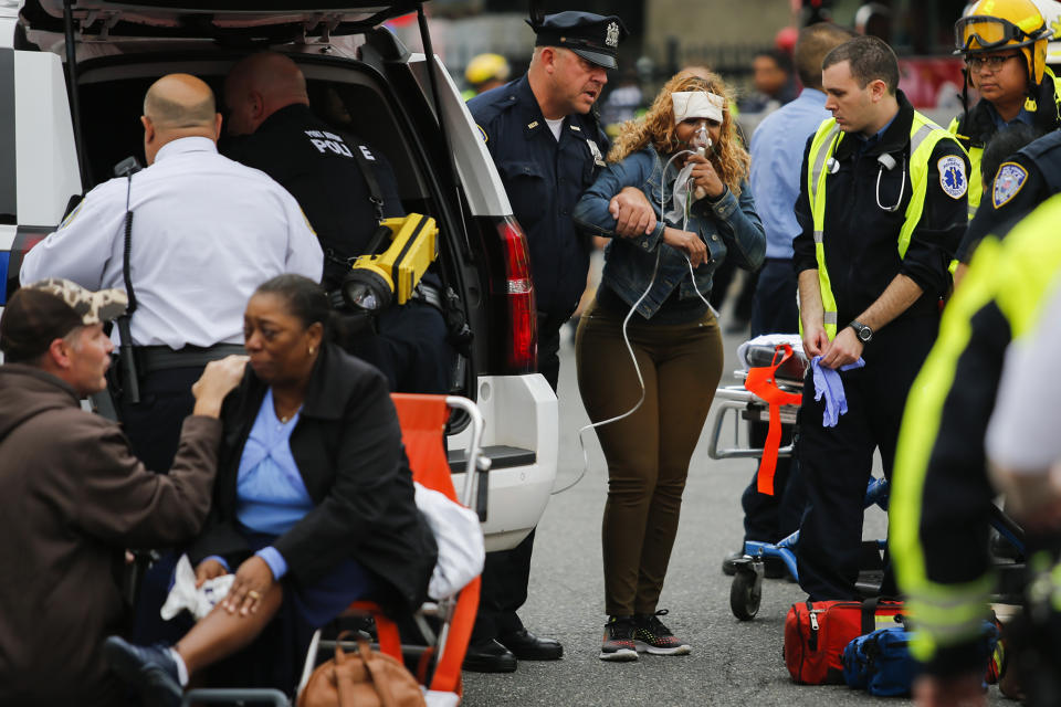 <p>People are treated for their injuries outside after a NJ Transit train crashed in to the platform at Hoboken Terminal September 29, 2016 in Hoboken, New Jersey. (Eduardo Munoz Alvarez/Getty Images) </p>