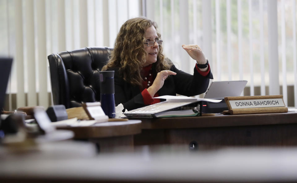 Texas School Board chair Donna Bahorich asks a question as the Texas School Board listens to public testimony as they prepares to vote on history curriculum, Tuesday, Nov. 13, 2018, in Austin, Texas. The Republican-controlled board is hearing from activists and academics who are defending or decrying proposed edits meant to streamline academic standards for history. (AP Photo/Eric Gay)