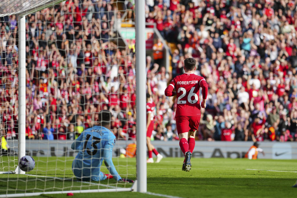 Liverpool's Andrew Robertson celebrates scoring his side's 2nd goal during the English Premier League soccer match between Liverpool and Tottenham Hotspur at Anfield Stadium in Liverpool, England, Sunday, May 5, 2024. (AP Photo/Jon Super)