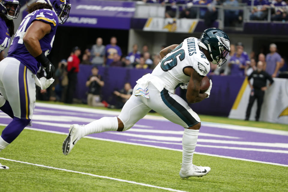 Philadelphia Eagles running back Miles Sanders, right, catches a 32-yard touchdown pass ahead of Minnesota Vikings middle linebacker Eric Kendricks, left, during the first half of an NFL football game, Sunday, Oct. 13, 2019, in Minneapolis. (AP Photo/Bruce Kluckhohn)