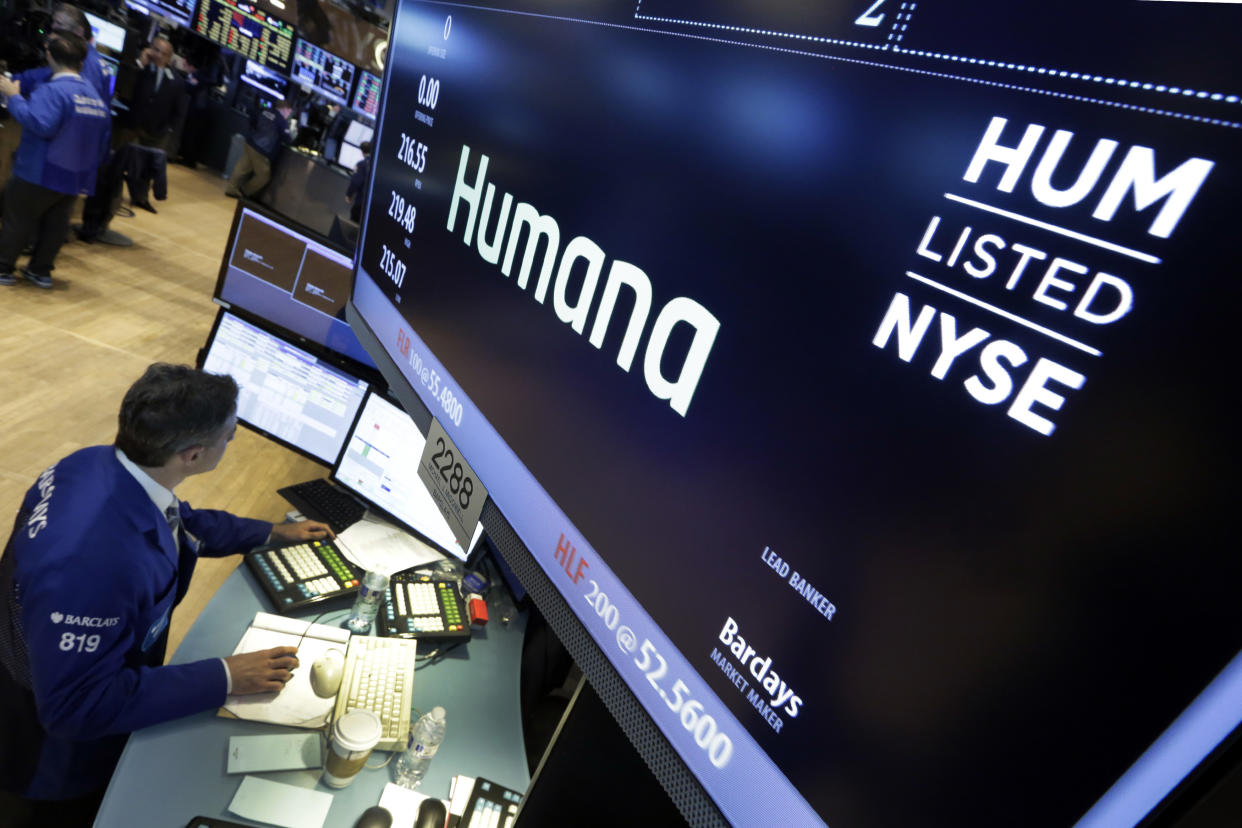 FILE - In this June 8, 2015, file photo specialist Anthony Rinaldi works adjacent to the post that handles Humana, on the floor of the New York Stock Exchange. Humana is adding two more independent directors to its board under an agreement with activist hedge fund Starboard Value. The Medicare Advantage coverage provider said Tuesday, Feb. 22, 2022, that it will add one director before the company’s annual shareholder meeting April 22 and the other afterward. (AP Photo/Richard Drew, File)