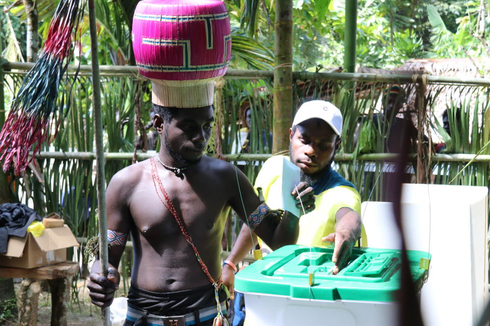 In this Nov. 29, 2019, photo, the Upe members vote at a men-only voting booth in the Bougainville referendum in Teau, Bougainville, Papua New Guinea. All across the Pacific region of Bougainville, people have been voting in a historic referendum to decide if they want to become the world’s newest nation by gaining independence from Papua New Guinea. (Jeremy Miller, Bougainville Referendum Commission via AP)