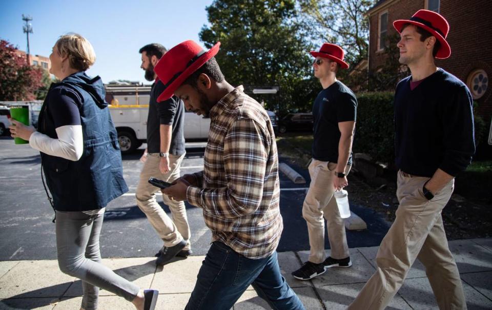 Red Hat employees walk back to their Raleigh headquarters after a meeting at the Duke Energy Center for the Performing Arts Monday, Oct. 29, 2018. IBM will acquire the Raleigh-based software maker in a $34 billion deal, the two companies announced Sunday.