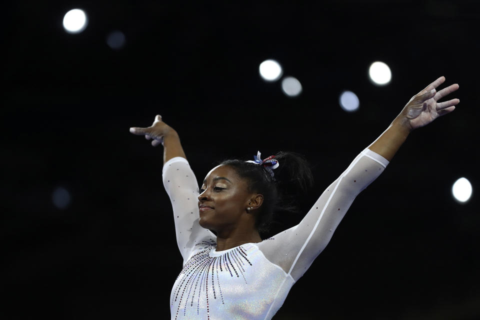 Simone Biles of the United States performs on the vault in the women's all-around final at the Gymnastics World Championships in Stuttgart, Germany, Thursday, Oct. 10, 2019. (AP Photo/Matthias Schrader)