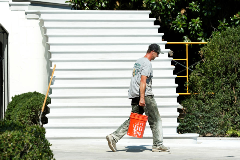 <p>A worker walks past the South Portico porch stairs of the White House after a renovation in Washington, Aug. 22, 2017. (Photo: Yuri Gripas/Reuters) </p>