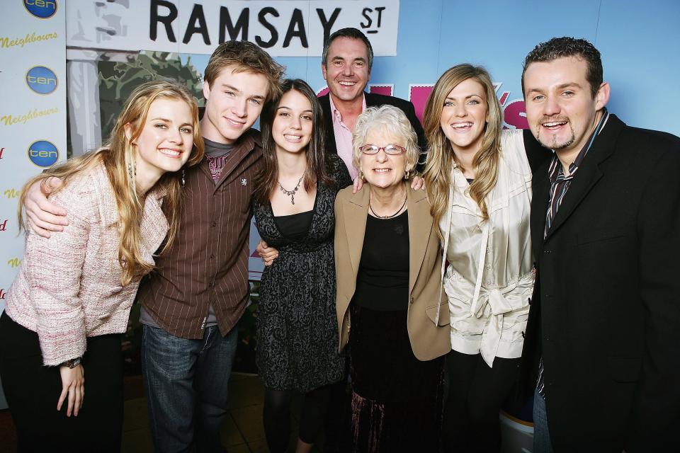 MELBOURNE, AUSTRALIA - AUGUST 04:  (L-R) Actors Tippa Black, Sam Clarke, Adelaide Kane, Alan Fletcher, Casting Director Jan Russ, Dolly Editor Bronwyn McCahon and actor Ryan Maloney pose together after Clarke and Kane were announced as the winners of Dolly Magazine?s national search to find two new Neighbours cast members, at Global Studios on August 4, 2006 in Melbourne, Australia. Dolly launched their competition for a girl (aged 12 to 16) and a boy (aged 15 to 18) to become new Neighbours cast members, and out of the 7000 entries, Clarke and Kane were picked and each win a minimum 3 month contract with the popular Australian soap.  (Photo by Kristian Dowling/Getty Images)