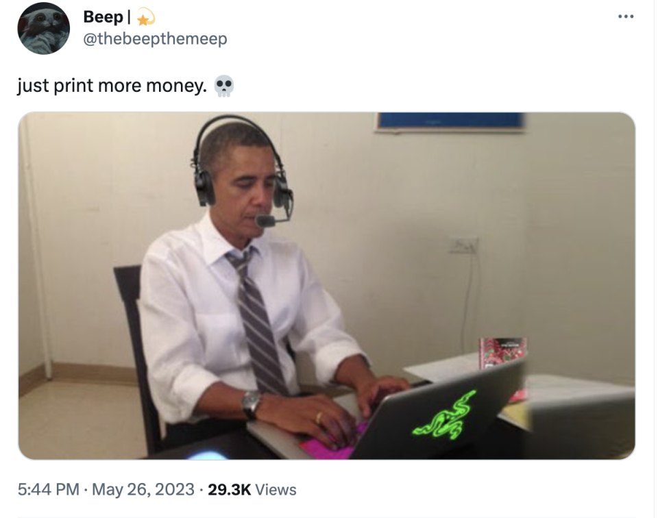 President Obama typing on a laptop with a fake headset with caption "Just print more money"