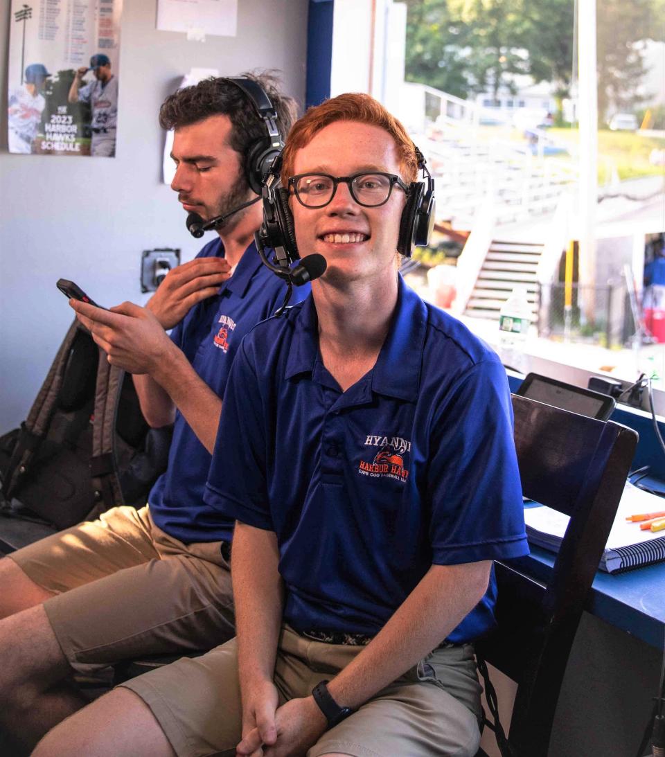 Jacob Irons and Mickey Doolittle, background, get ready to broadcast a game for the Hyannis Harbor Hawks in the press box at McKeon Park.