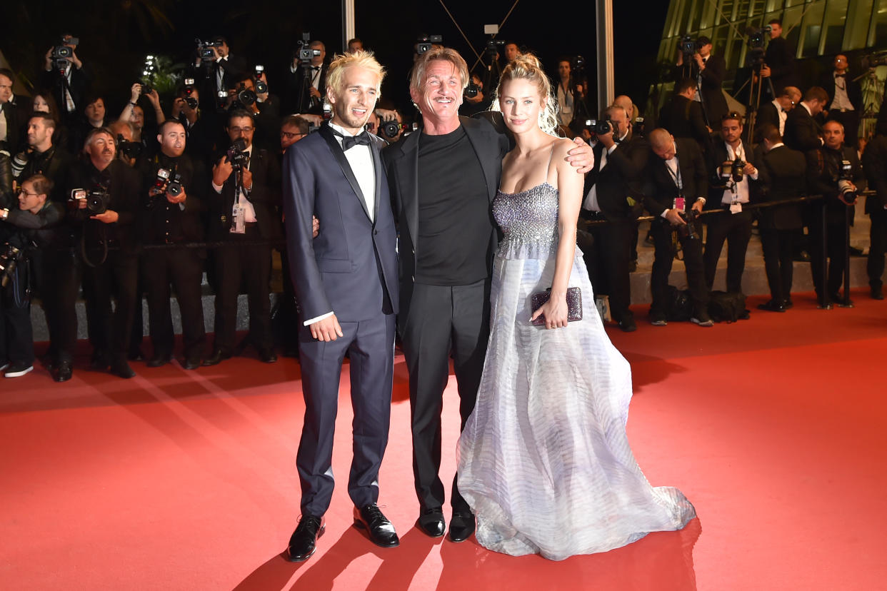 US actor and director Sean Penn (C) poses with his children US actor Hopper Jack Penn (L) and US actress Dylan Penn before leaving the Festival Palace on May 20, 2016 after the screening of the film 