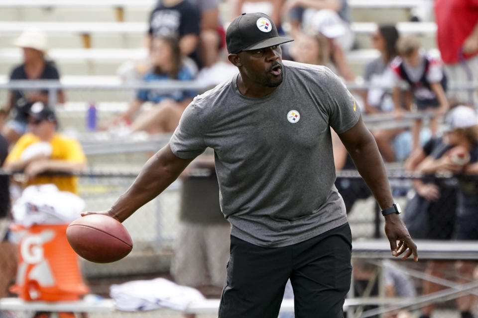 FILE - Pittsburgh Steelers senior defensive assistant Brian Flores works with the defense as they go through drills during practice at NFL football training camp in the Latrobe Memorial Stadium in Latrobe, Pa., Monday, Aug. 8, 2022. othing can slow the NFL’s popularity, but there are significant, unsavory off-field issues that are looming over the league as the season heads to the second half: multiple investigations of Commanders owner Daniel Snyder; the suspension and pending return of Browns QB Deshaun Watson; the lawsuit brought by Steelers assistant coach Brian Flores. (AP Photo/Keith Srakocic, File)