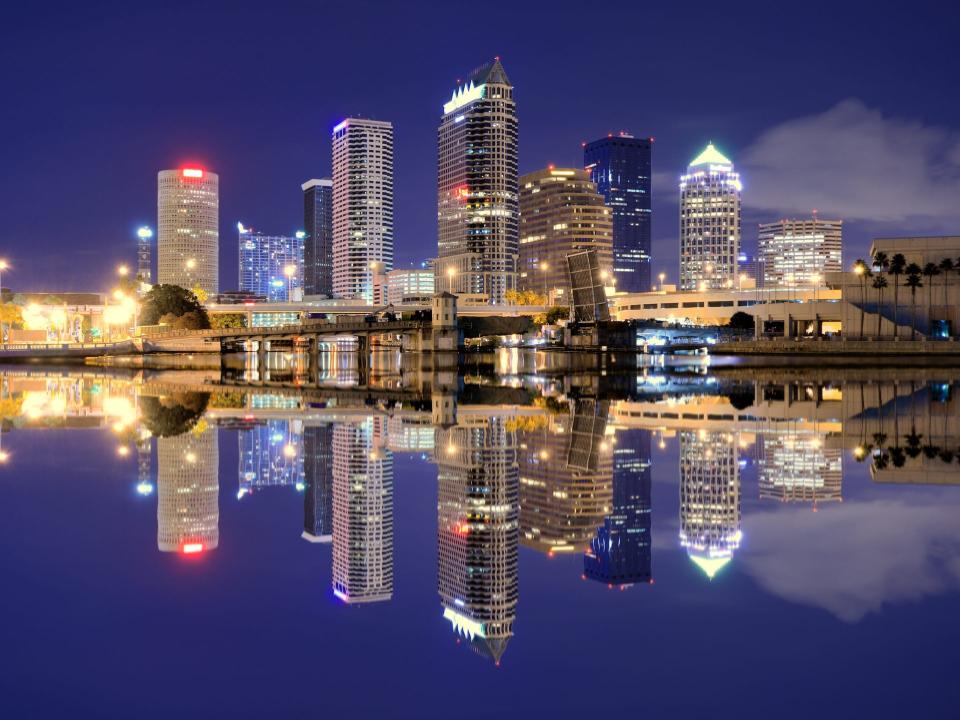 Downtown Tampa, Florida's skyline is reflected in the water.